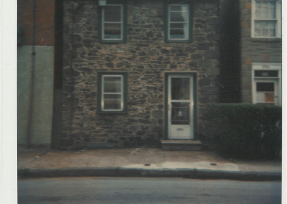 A color Polaroid image shows the Leech House with a green roof and green trim.