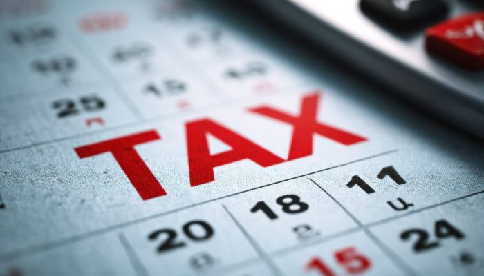  The red word TAX is printed on a calendar