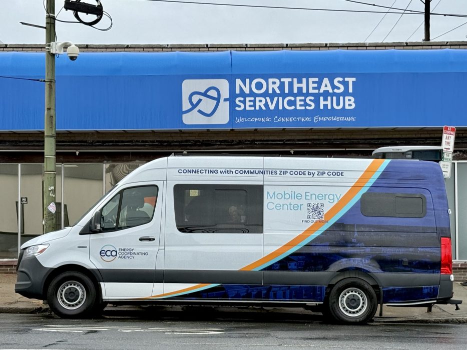 An electric van labeled as the "Mobile Energy Center" parked in front of a building in Philadelphia.