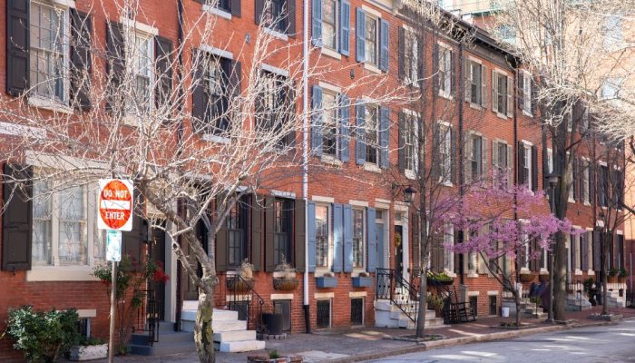 Rowhouses with a Do Not Enter sign in front