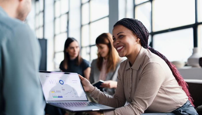 Two people looking at computer screen showing HOME Optimization dashboard on Philly Stat 360