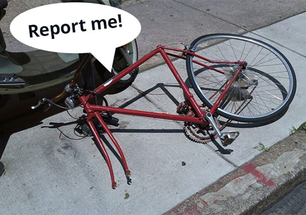 An abandoned and unusable bike in the public right of way