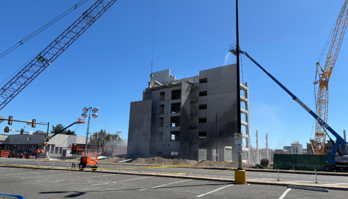 Gras Ferry parking garage surrounded by cranes and utility vehicles