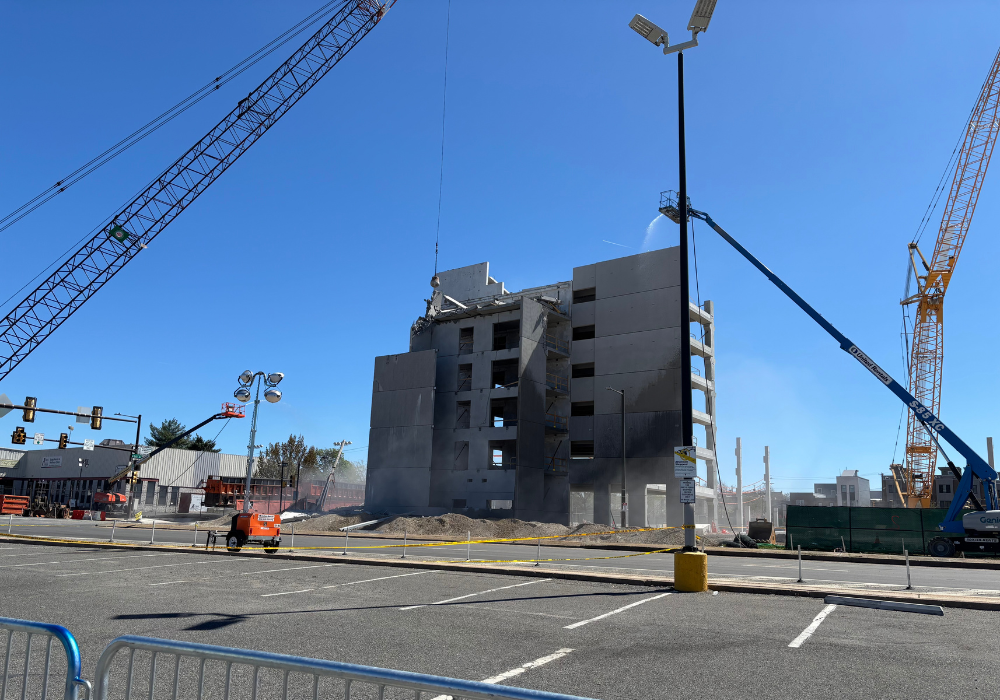 Gras Ferry parking garage surrounded by cranes and utility vehicles