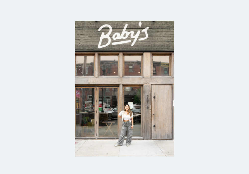 Baby's Kusina business owner standing in front of the business