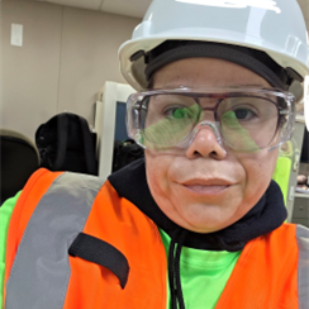 Construction wearing a hard hat and vest