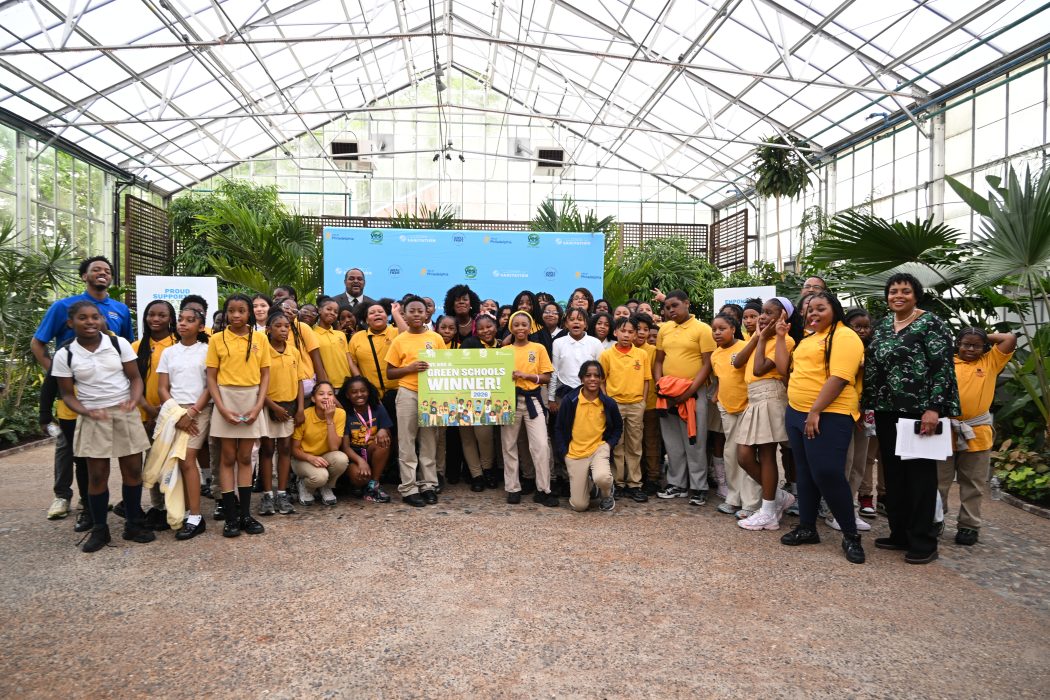Mayor Parker and City officials pose with various children and adults at the Green Schools event.