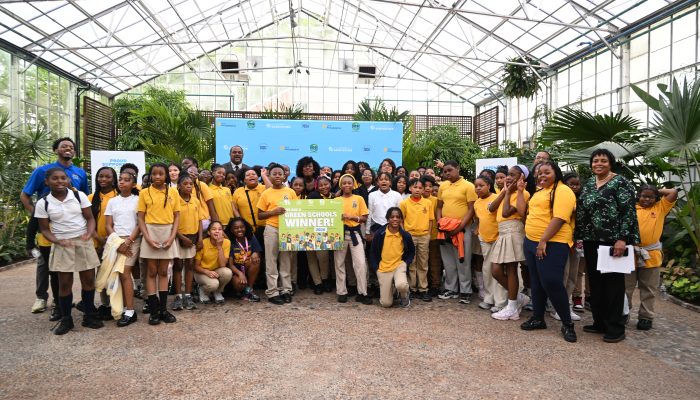 Mayor Parker and City officials pose with various children and adults at the Green Schools event.