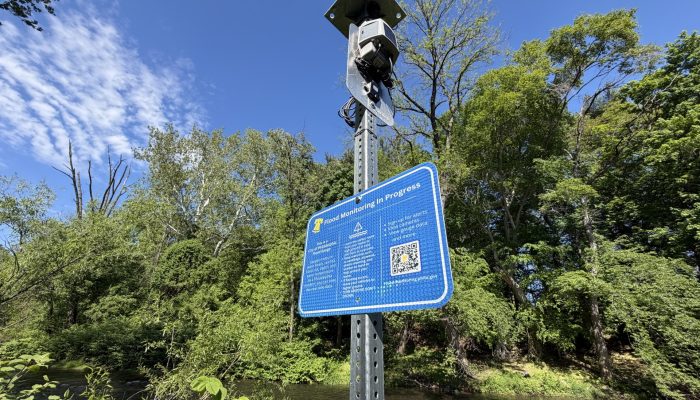 A flood monitoring gauge and sign explaining how it works at Pennypack Creek in Holmesburg Northeast Philadelphia