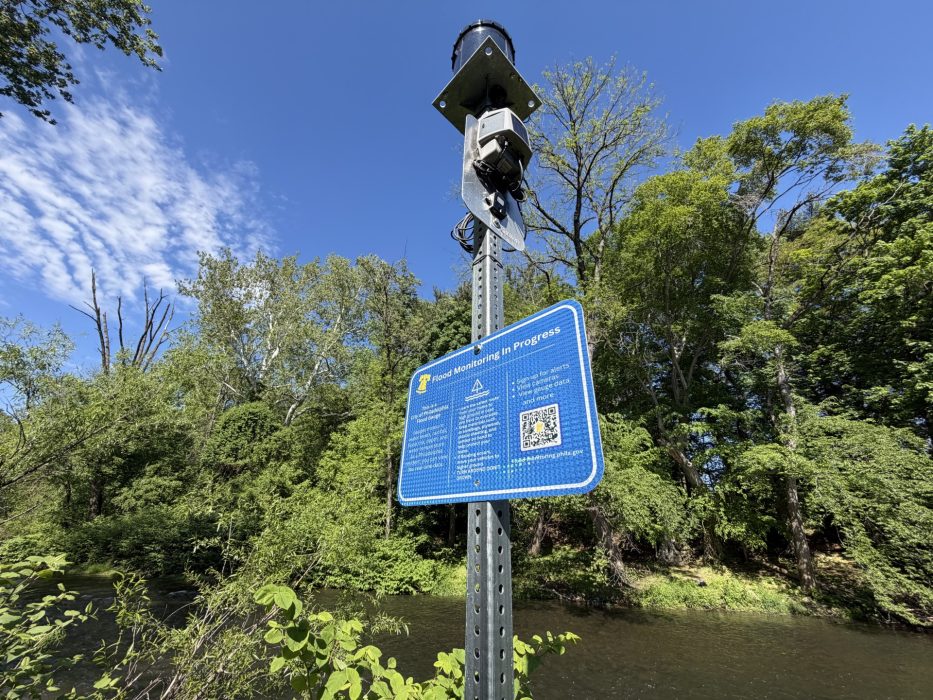 A flood monitoring gauge and sign explaining how it works at Pennypack Creek in Holmesburg Northeast Philadelphia