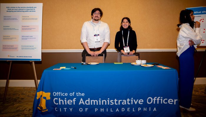 Two members of the CAO team staffing the Service Standards table.