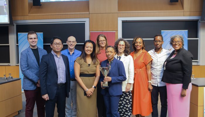 Participants in the 2025 Startup World Cup Pitch Competition post together, with the competition winners holding their trophy.
