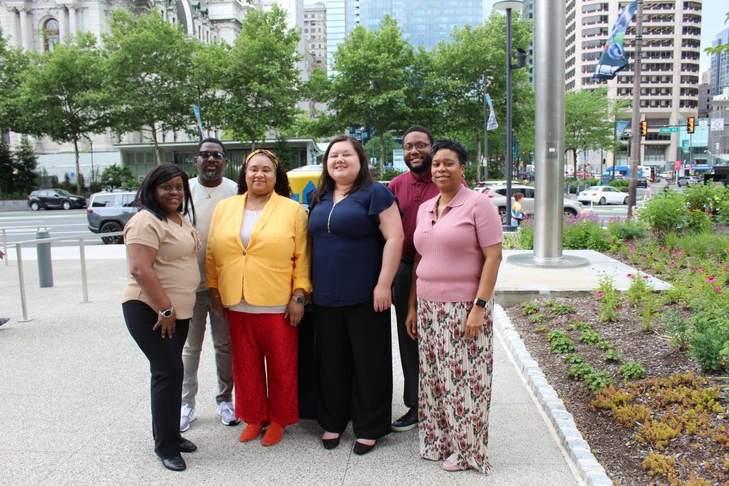 Five staff members from PVCOOP pose in front of City Hall