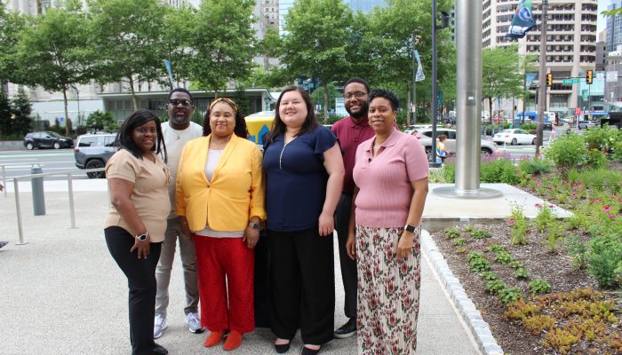 Five staff members from PVCOOP pose in front of City Hall