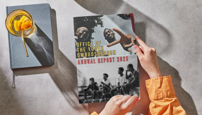 Picture of someone holding the OYO 2025 annual report.