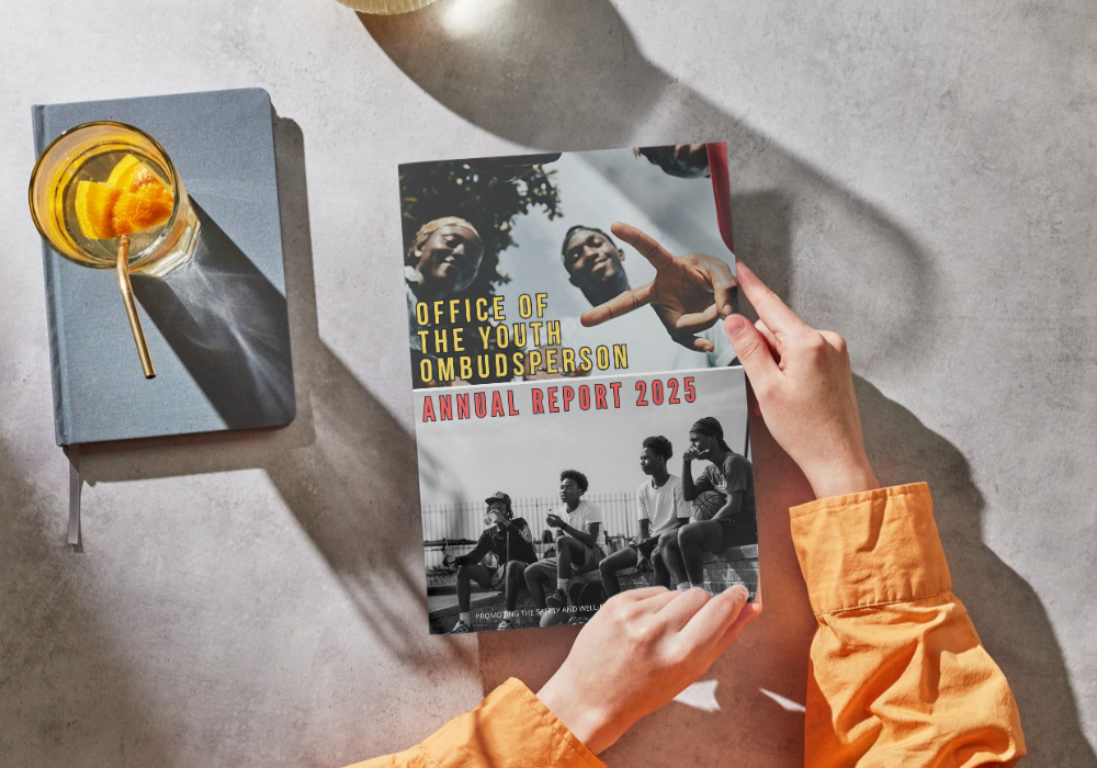 Picture of someone holding the OYO 2025 annual report.