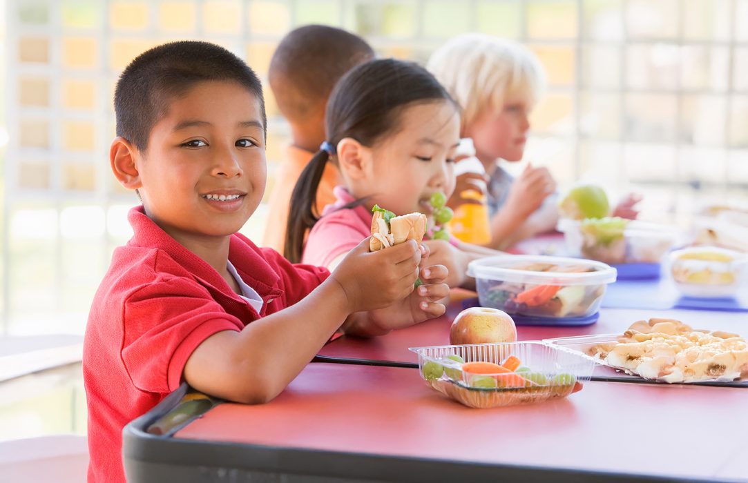 Boy enjoying a FREE Summer meal!