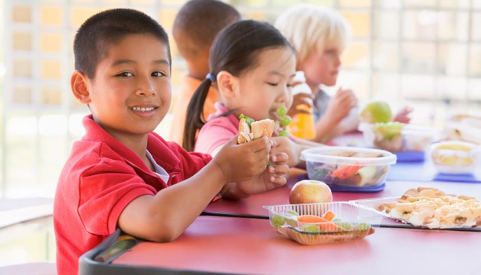 Boy enjoying a FREE Summer meal!