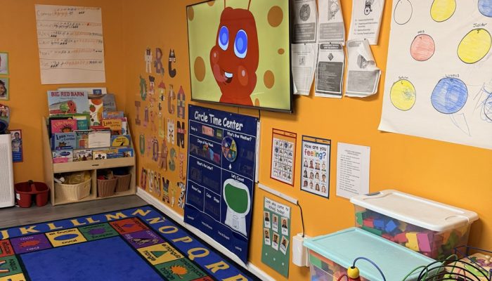 A classroom at A Secure Future Academy with artwork from students on the wall
