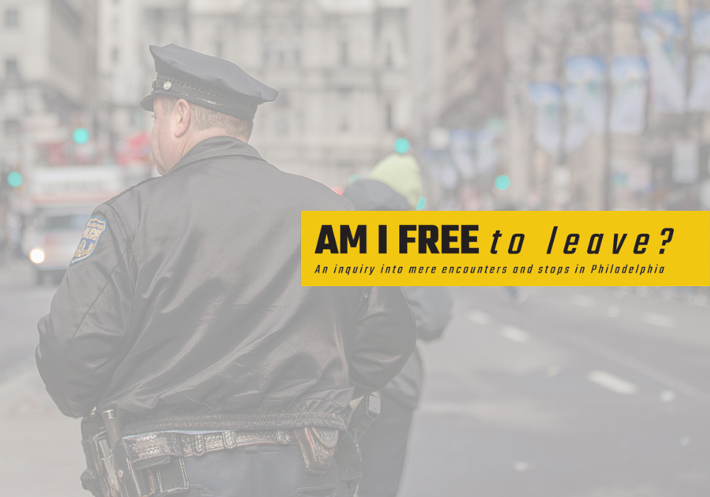 Police officer standing with his back in the middle of Broad Street.