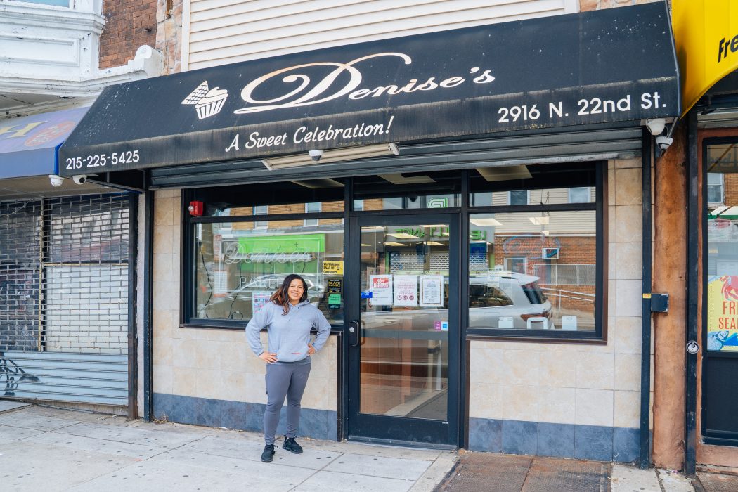 Business owner stands in front of Denise's Delicacies, a family-owned business that has been a staple in the North Philadelphia area for almost four decades.