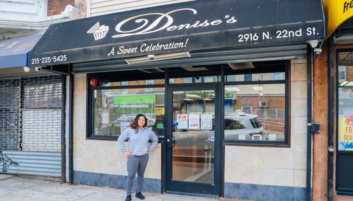 Business owner stands in front of Denise's Delicacies, a family-owned business that has been a staple in the North Philadelphia area for almost four decades.