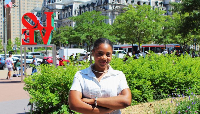 Tayja poses for headshot in Love Park