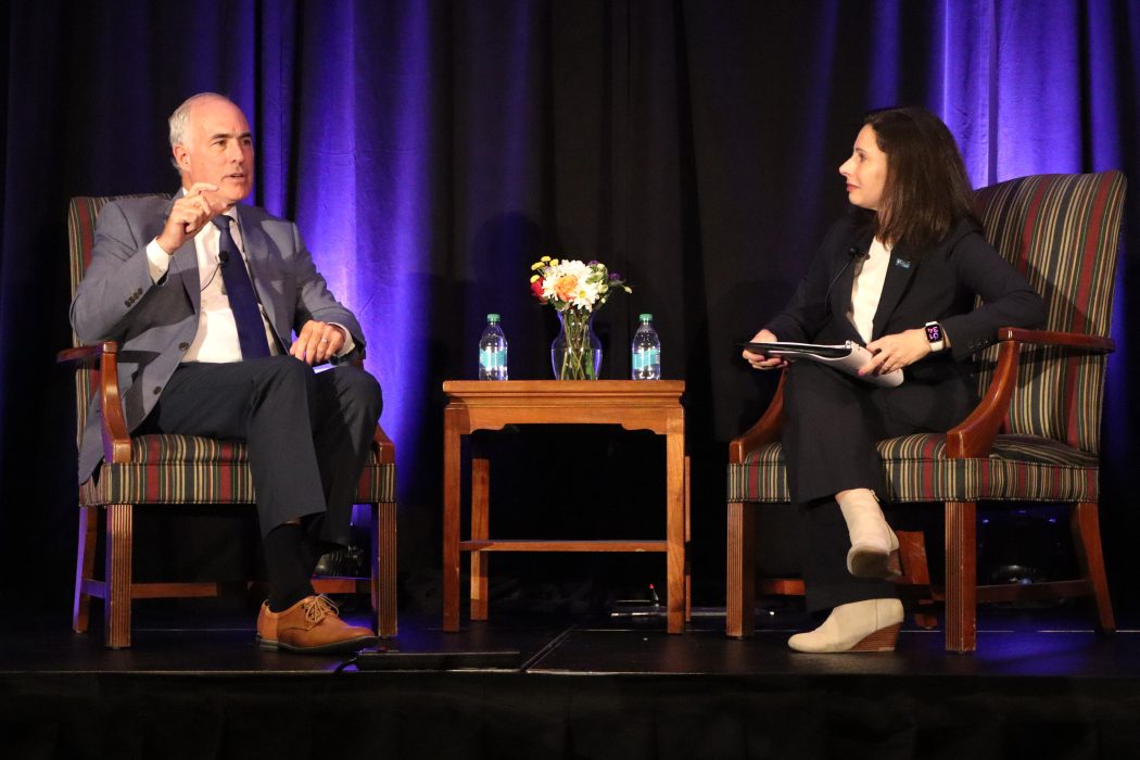 Bob Casey and Renee Garcia engage in conversation on stage