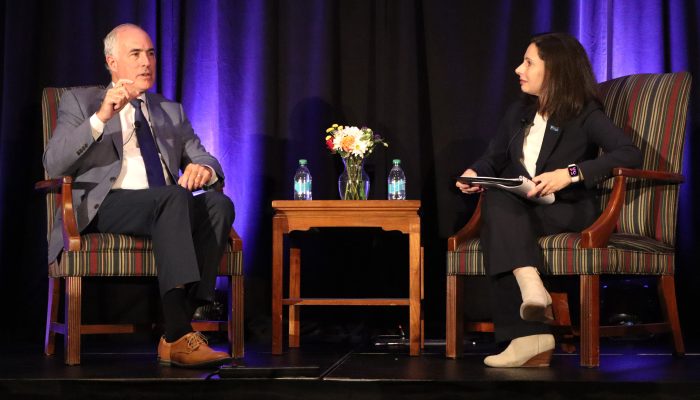 Bob Casey and Renee Garcia engage in conversation on stage