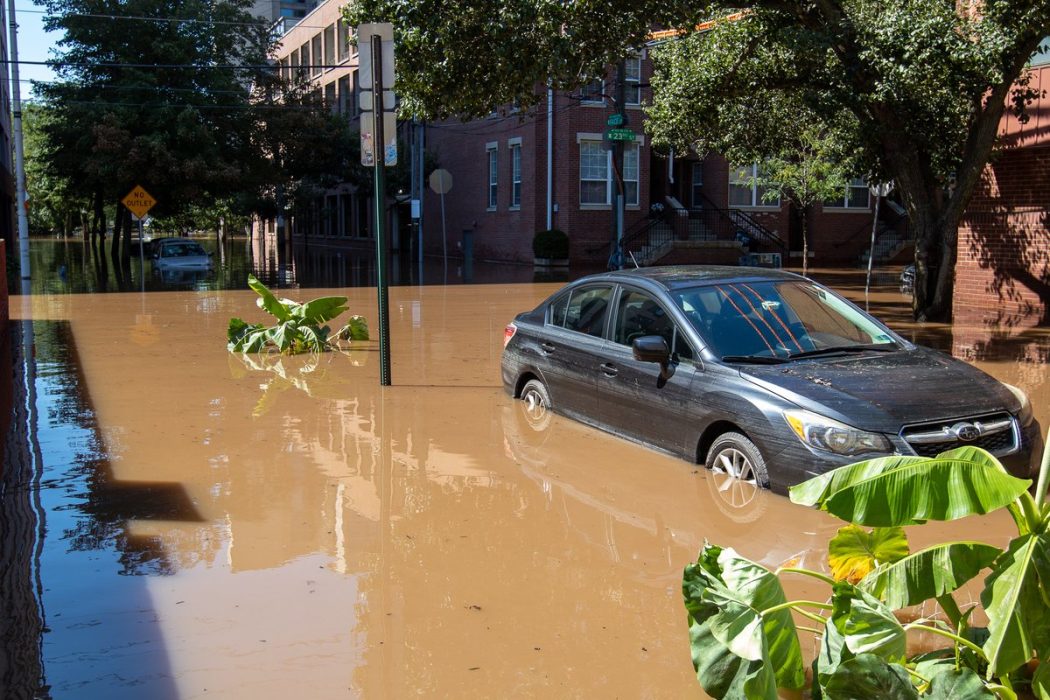 A car submerged in a flooded street after a hurricane