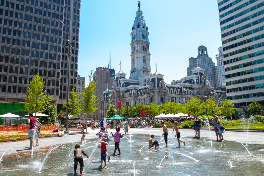 City hall and spary grounds with children playing