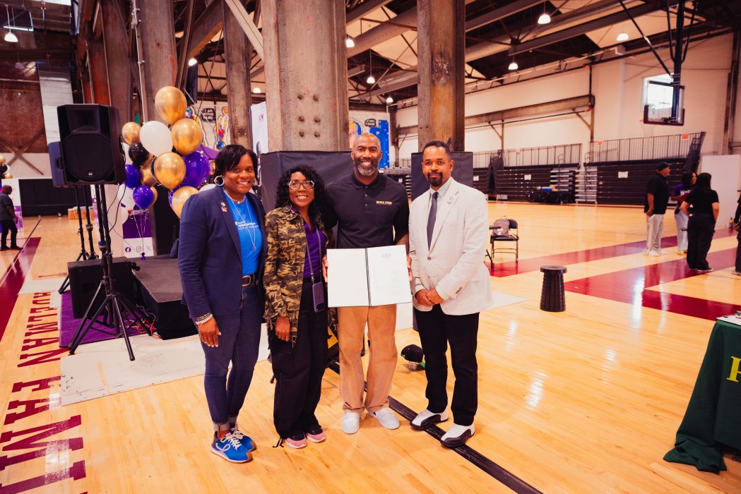 Malcolm Jenkins (middle right) holds a certificate of recognition and stands next to, Senator Sharif Street (right), Gwendolyn Jenkins (middle left), and DHS Commissioner Kimberly Ali (left).