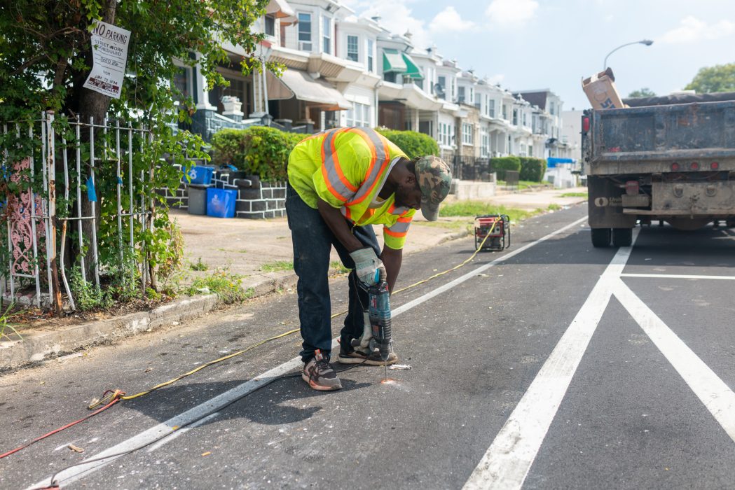A construction worker working on the street