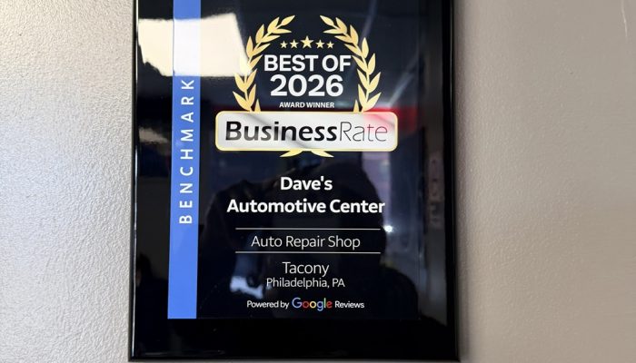 A plaque on the wall at Dave's Automotive reading, "Best of 2026 BuisnessRate"